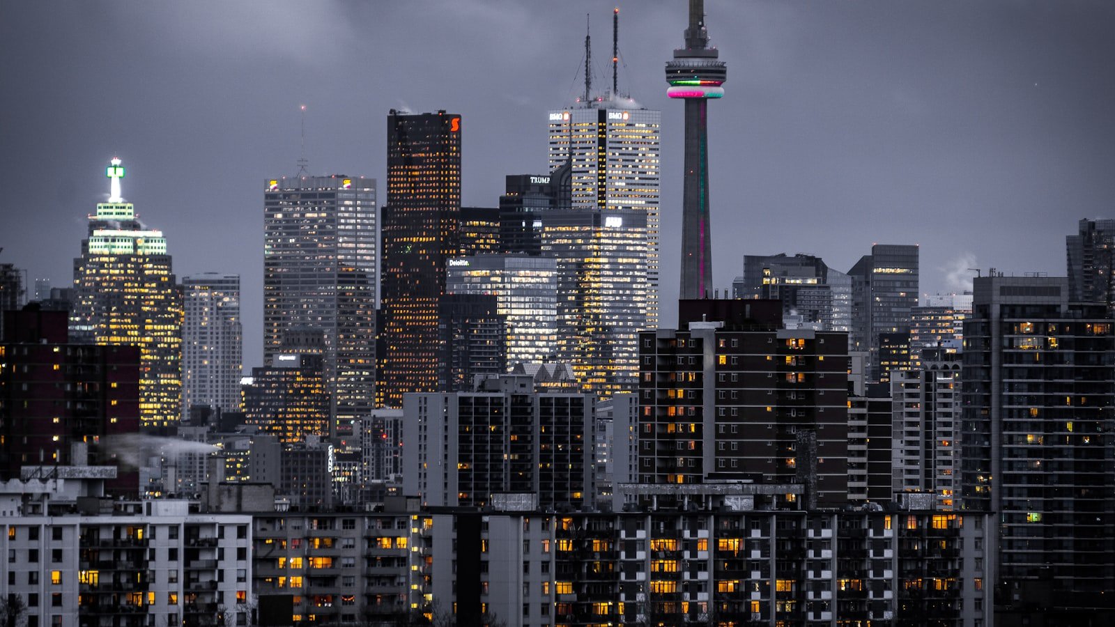 Toronto financial district skyline at dusk with the CN Tower and downtown condo towers